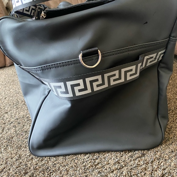 I am selling a Versace duffel bag. It is silver and black. - Picture 3 of 7